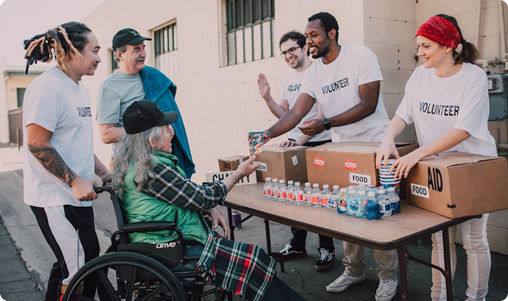 Volunteers distributing food and aid at a community event